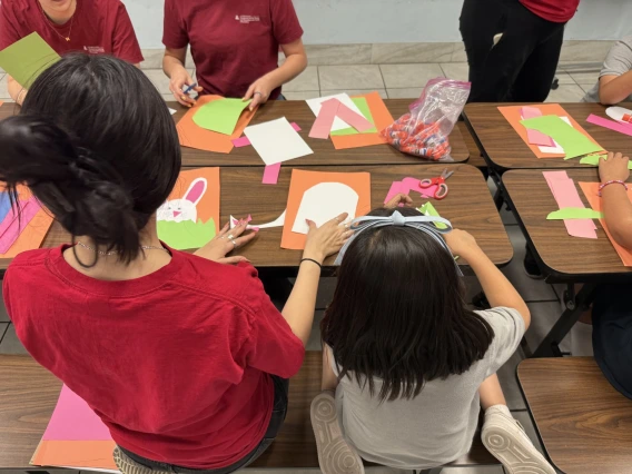Two people doing arts and crafts