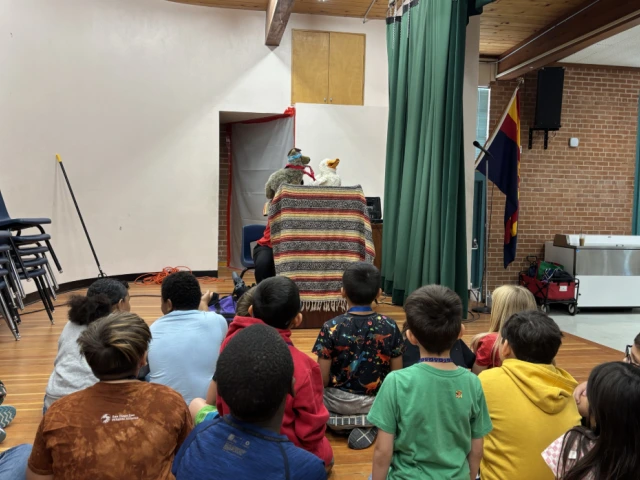 Kids watching a puppet show