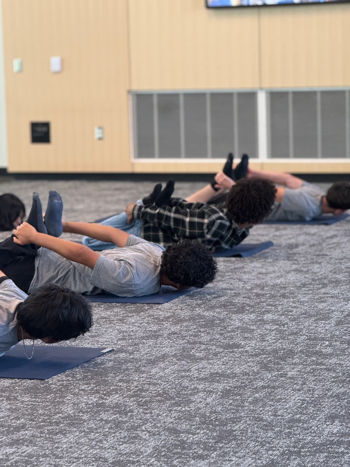 Students doing Yoga poses. 
