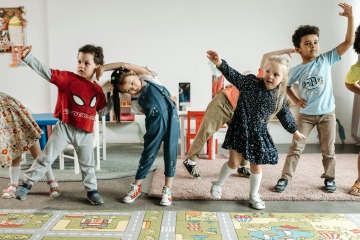 Kids dancing in a classroom