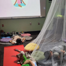 Kids in the Zen Den laying down doing breathing exercises. 